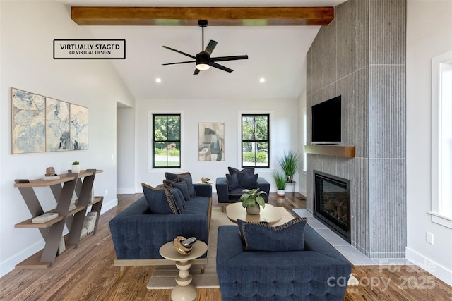 120 Gashes Creek Rd, Asheville, NC 28805 - living room featuring a large fireplace, a ceiling fan, wood finished floors, beam ceiling, and high vaulted ceiling