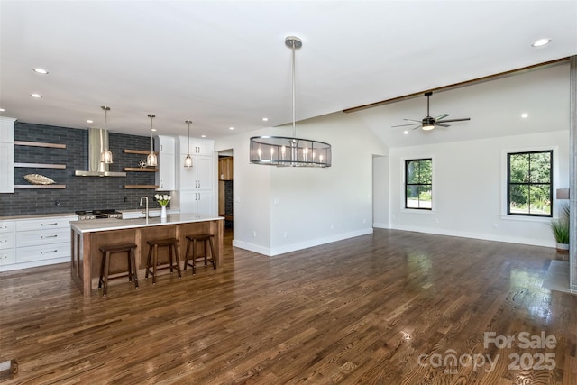 120 Gashes Creek Rd, Asheville, NC 28805 - kitchen with wall chimney exhaust hood, open shelves, white cabinetry, recessed lighting, and lofted ceiling