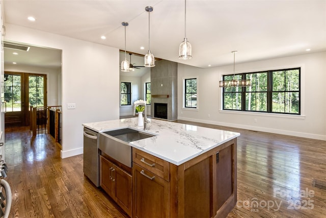 120 Gashes Creek Rd, Asheville, NC 28805 - kitchen with stainless steel dishwasher, brown cabinetry, open floor plan, dark wood finished floors, and recessed lighting
