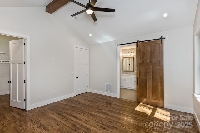 120 Gashes Creek Rd, Asheville, NC 28805 - unfurnished bedroom featuring a barn door, dark wood-style flooring, recessed lighting, ensuite bath, and a spacious closet