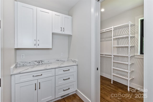 120 Gashes Creek Rd, Asheville, NC 28805 - kitchen featuring dark wood finished floors, white cabinets, and light stone counters