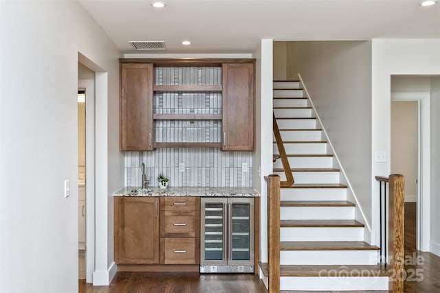 120 Gashes Creek Rd, Asheville, NC 28805 - bar area featuring beverage cooler, dark wood-style floors, stairway, recessed lighting, and backsplash