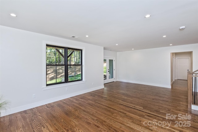 120 Gashes Creek Rd, Asheville, NC 28805 - unfurnished living room with recessed lighting, dark wood-type flooring, and french doors