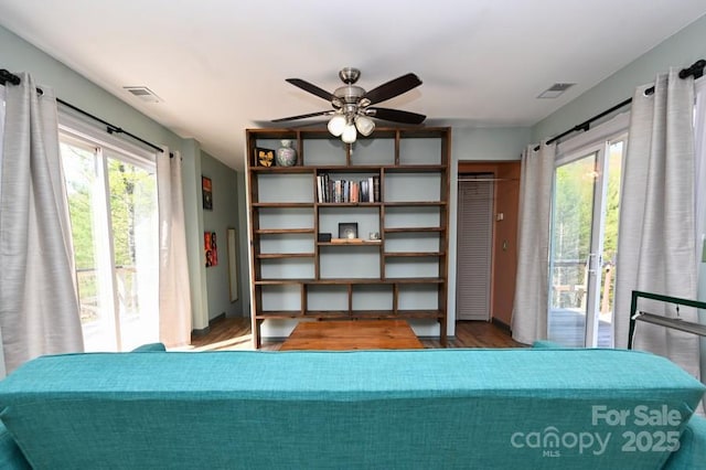 2668 Reedy Branch Rd, Purlear, NC 28665 - bedroom with access to exterior, wood finished floors, multiple windows, and a ceiling fan