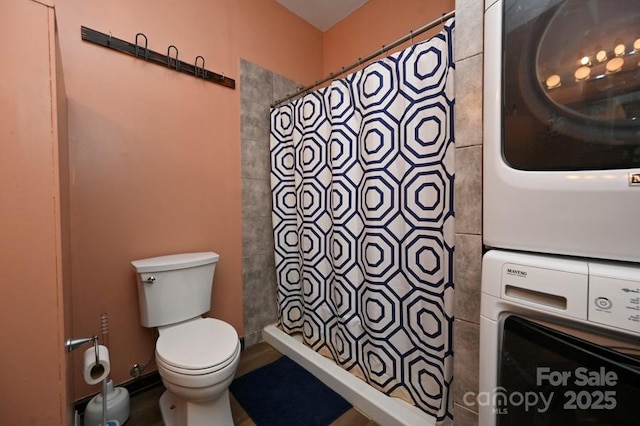 2668 Reedy Branch Rd, Purlear, NC 28665 - bathroom with stacked washer and clothes dryer and a shower with curtain