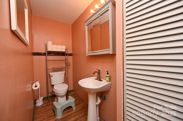 2668 Reedy Branch Rd, Purlear, NC 28665 - half bath with toilet and wood finished floors