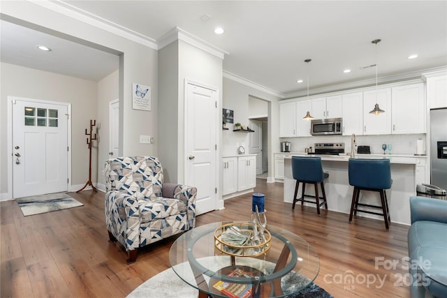 7516 Ohara St, Huntersville, NC 28078 - living room with ornamental molding, dark wood finished floors, and recessed lighting