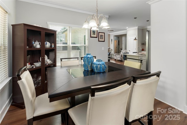 7516 Ohara St, Huntersville, NC 28078 - dining room featuring dark wood-style floors, a chandelier, and ornamental molding