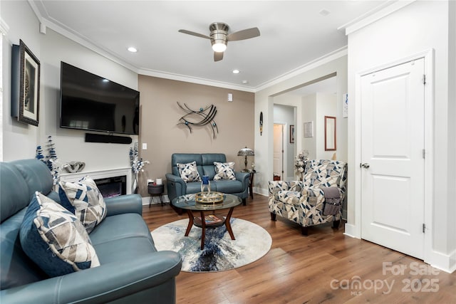 7516 Ohara St, Huntersville, NC 28078 - living area featuring ceiling fan, wood finished floors, crown molding, recessed lighting, and a fireplace