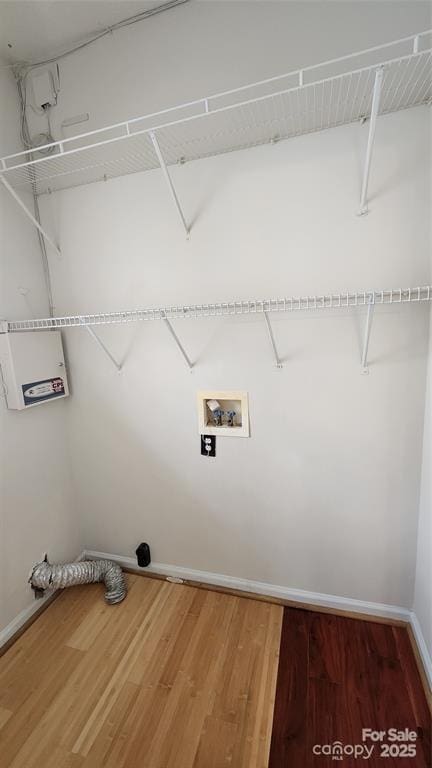 10607 Old Bridge Ln, Charlotte, NC 28269 - laundry area featuring wood finished floors and hookup for a washing machine