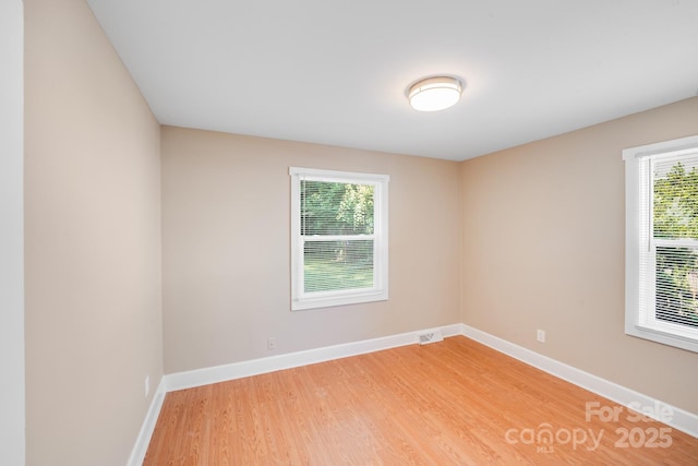 2405 Greenland Ave, Charlotte, NC 28208 - unfurnished room featuring light wood finished floors and baseboards