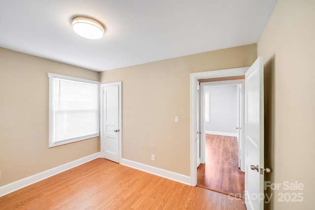 2405 Greenland Ave, Charlotte, NC 28208 - unfurnished bedroom with light wood-type flooring and baseboards