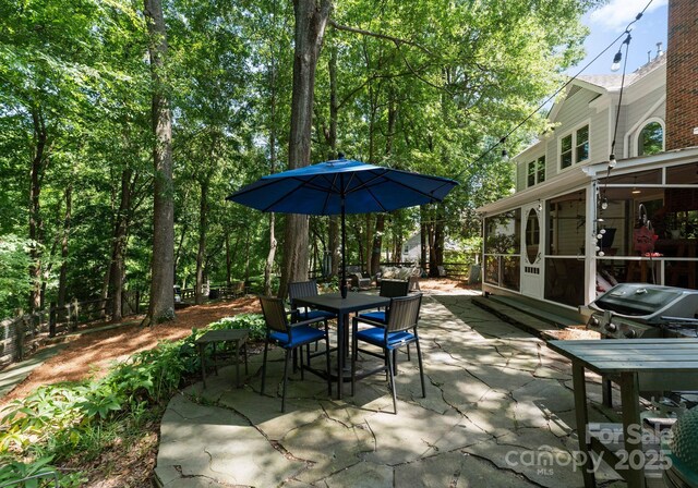 9141 Covey Hollow Ct, Charlotte, NC 28210 - view of patio / terrace featuring a sunroom and outdoor dining space
