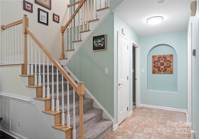9141 Covey Hollow Ct, Charlotte, NC 28210 - staircase featuring baseboards