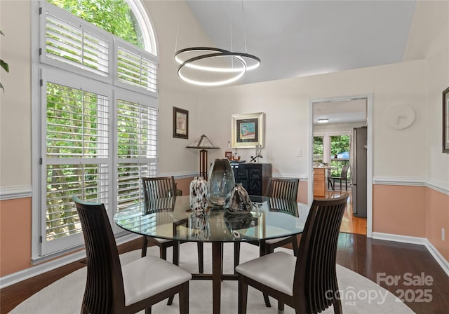 9141 Covey Hollow Ct, Charlotte, NC 28210 - dining area with wood finished floors and a towering ceiling