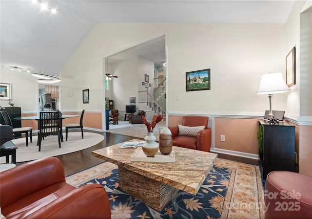 9141 Covey Hollow Ct, Charlotte, NC 28210 - living area with wood finished floors, lofted ceiling, and stairway