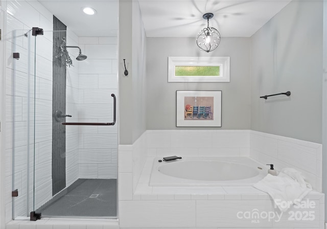 9141 Covey Hollow Ct, Charlotte, NC 28210 - bathroom with a garden tub, a shower stall, and recessed lighting