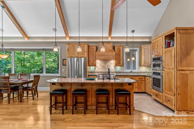 429 Turtle Head Dr, Nebo, NC 28761 - kitchen with freestanding refrigerator, premium range hood, open shelves, decorative backsplash, and light stone countertops