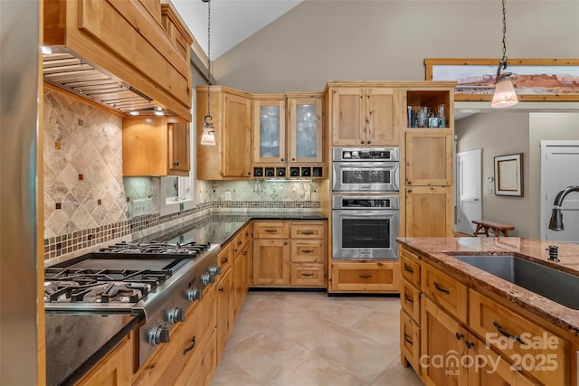 429 Turtle Head Dr, Nebo, NC 28761 - kitchen with custom range hood, stainless steel appliances, hanging light fixtures, dark stone counters, and high vaulted ceiling