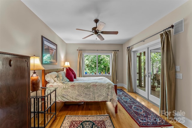 429 Turtle Head Dr, Nebo, NC 28761 - bedroom with access to exterior, french doors, wood finished floors, and ceiling fan