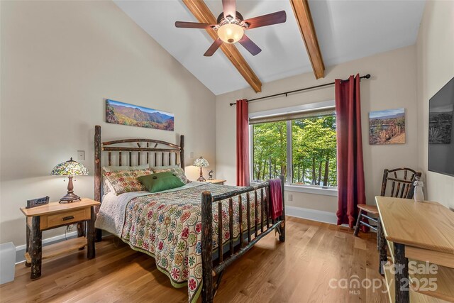 429 Turtle Head Dr, Nebo, NC 28761 - bedroom featuring wood finished floors, beam ceiling, ceiling fan, and high vaulted ceiling