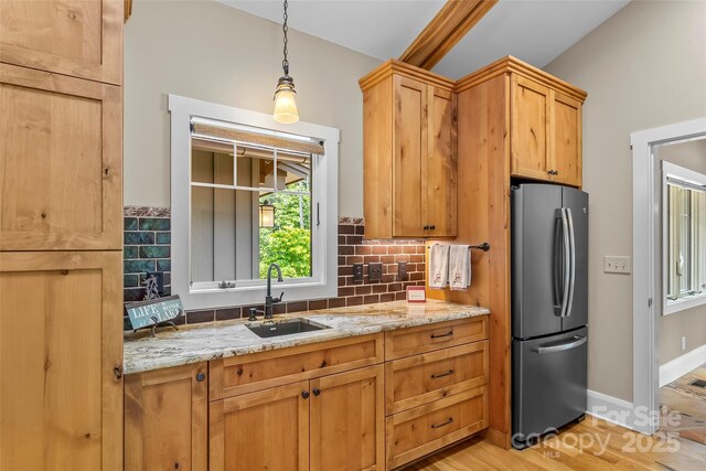 429 Turtle Head Dr, Nebo, NC 28761 - kitchen featuring freestanding refrigerator, decorative backsplash, light stone countertops, and decorative light fixtures