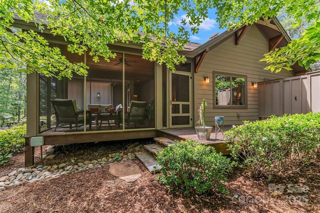 429 Turtle Head Dr, Nebo, NC 28761 - rear view of house featuring a sunroom, a deck, and roof with shingles