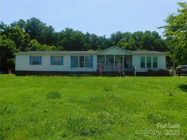 33343 Old Salisbury Rd, Albemarle, NC 28001 - manufactured / mobile home featuring a front yard and a porch