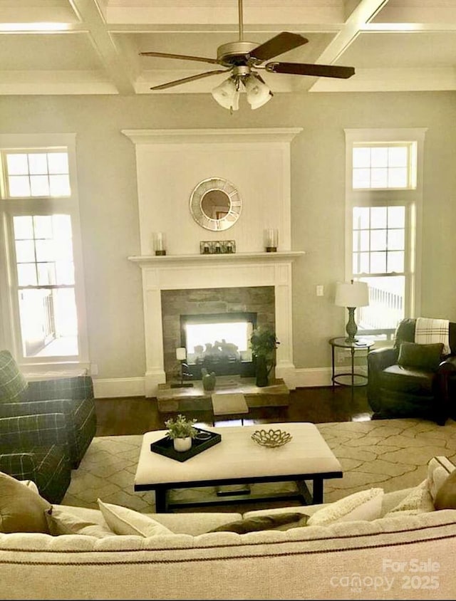 104 Bunker Way, Mooresville, NC 28117 - living area featuring coffered ceiling, a high end fireplace, beamed ceiling, ceiling fan, and plenty of natural light