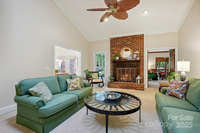 5008 Saddle Horn Trl, Weddington, NC 28104 - living room featuring carpet floors, plenty of natural light, a ceiling fan, high vaulted ceiling, and a fireplace