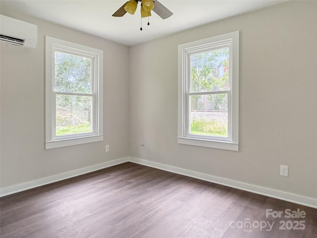36 Graybark Ct, Waynesville, NC 28786 - unfurnished room featuring a wall mounted AC, plenty of natural light, dark wood-style flooring, and ceiling fan