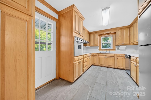 422 Wagner St, Troutman, NC 28166 - kitchen with stainless steel appliances, light countertops, and light brown cabinetry