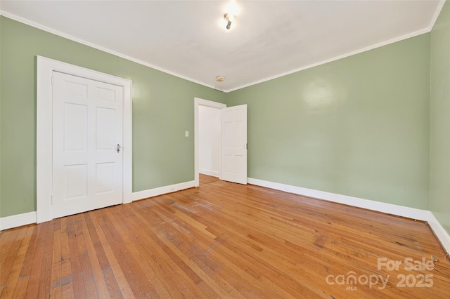 422 Wagner St, Troutman, NC 28166 - unfurnished bedroom featuring ornamental molding and wood-type flooring