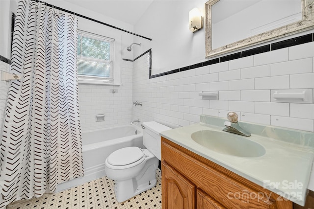 422 Wagner St, Troutman, NC 28166 - full bath with shower / bath combo, tile walls, vanity, tile patterned floors, and a wainscoted wall
