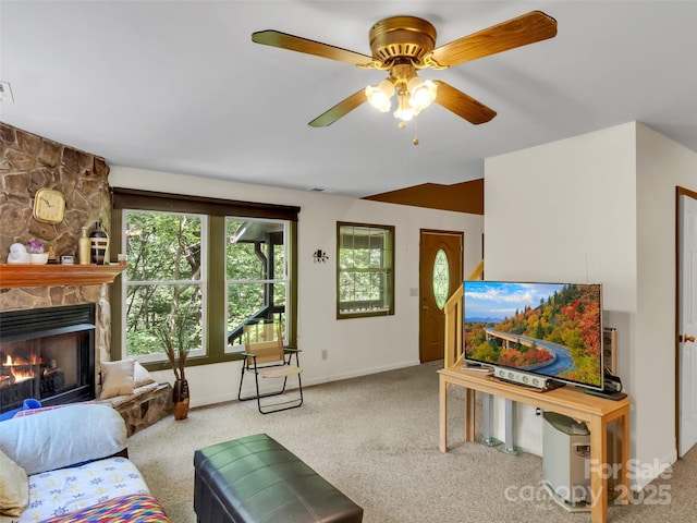 57 Copperhead Cv, Sylva, NC 28779 - living room featuring healthy amount of natural light, carpet floors, and a stone fireplace