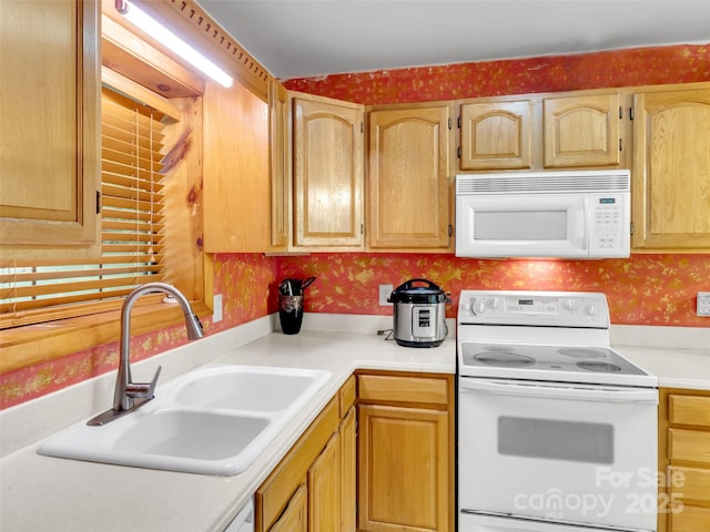 57 Copperhead Cv, Sylva, NC 28779 - kitchen with white appliances, wallpapered walls, light countertops, and light brown cabinets