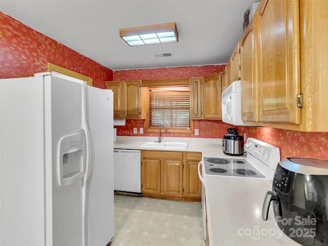 57 Copperhead Cv, Sylva, NC 28779 - kitchen featuring white appliances, wallpapered walls, light countertops, and light floors