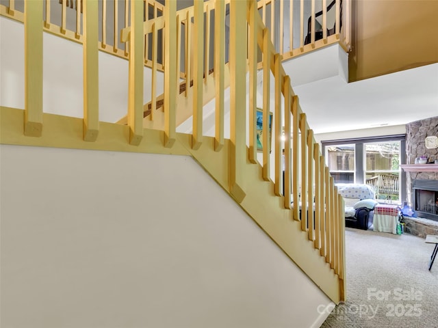 57 Copperhead Cv, Sylva, NC 28779 - stairway with carpet and a stone fireplace