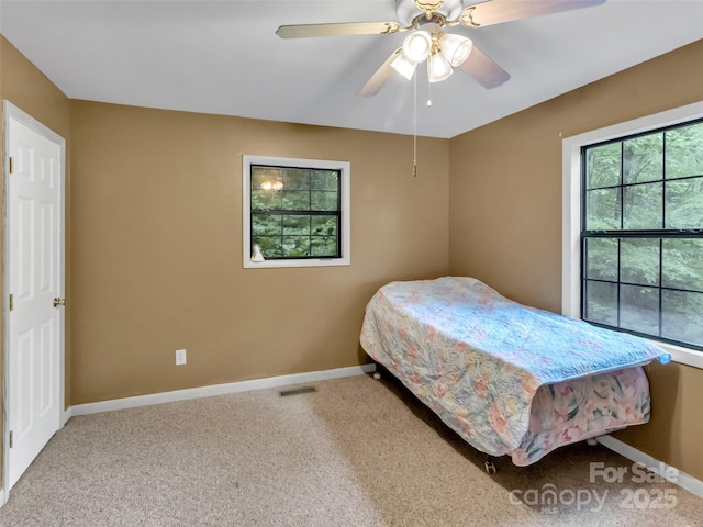 57 Copperhead Cv, Sylva, NC 28779 - carpeted bedroom with baseboards and a ceiling fan