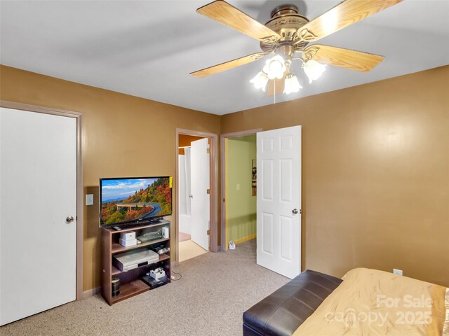 57 Copperhead Cv, Sylva, NC 28779 - carpeted bedroom with ceiling fan and ensuite bathroom