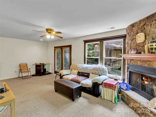 57 Copperhead Cv, Sylva, NC 28779 - living area with carpet floors, a stone fireplace, and ceiling fan