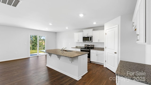 462 Janie Cir Unit 100, Newton, NC 28658 - kitchen featuring stainless steel appliances, dark wood-style floors, dark stone counters, white cabinetry, and recessed lighting