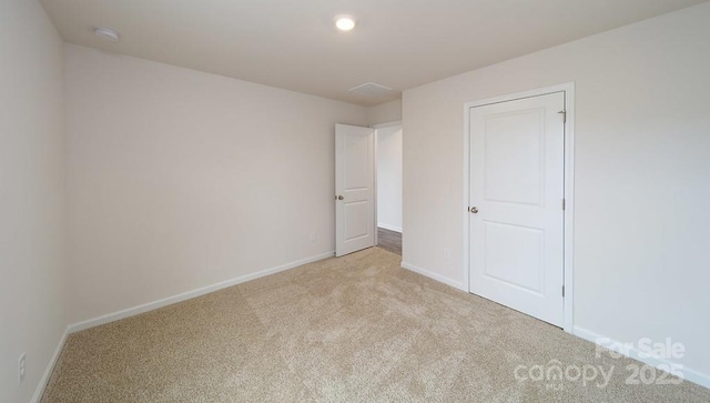 462 Janie Cir Unit 100, Newton, NC 28658 - unfurnished bedroom with light carpet and baseboards