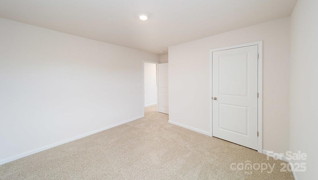 462 Janie Cir Unit 100, Newton, NC 28658 - unfurnished bedroom featuring light colored carpet and recessed lighting