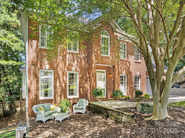 11126 Windgate Ct, Tega Cay, SC 29708 - colonial inspired home featuring brick siding, an outdoor hangout area, and a patio area