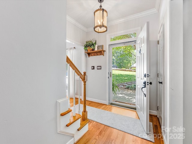 11126 Windgate Ct, Tega Cay, SC 29708 - entryway featuring stairway, wood finished floors, crown molding, and a chandelier