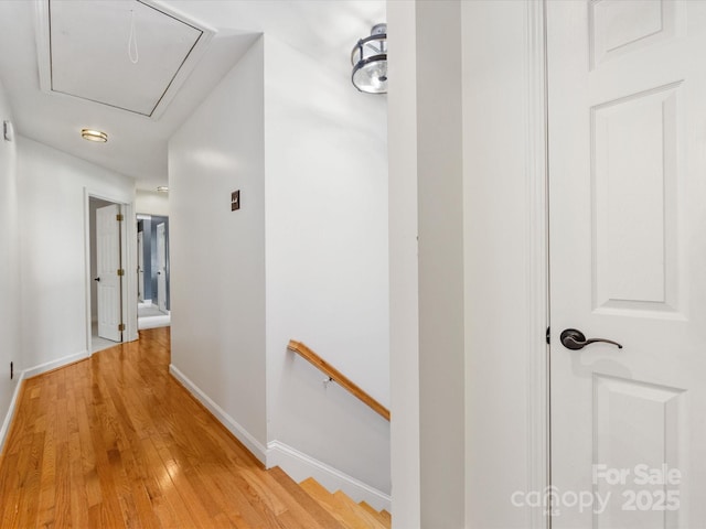 11126 Windgate Ct, Tega Cay, SC 29708 - hallway featuring attic access, light wood-style floors, and an upstairs landing
