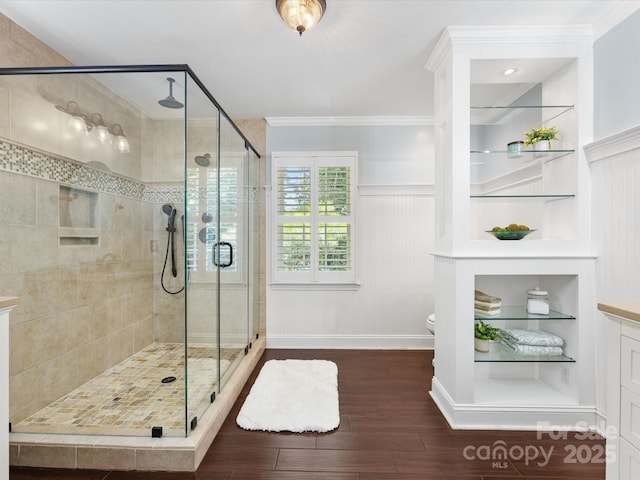 11126 Windgate Ct, Tega Cay, SC 29708 - full bathroom with wood finished floors, a stall shower, built in features, and ornamental molding