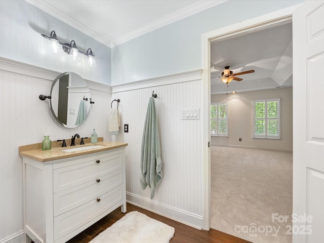 11126 Windgate Ct, Tega Cay, SC 29708 - bathroom with vanity, ceiling fan, ornamental molding, and wood finished floors