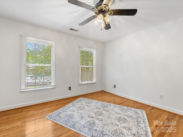 11126 Windgate Ct, Tega Cay, SC 29708 - empty room with a ceiling fan and wood finished floors
